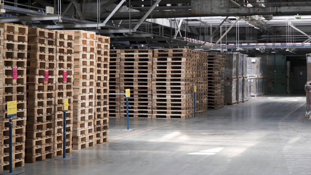 Warehouse stacked pallets image